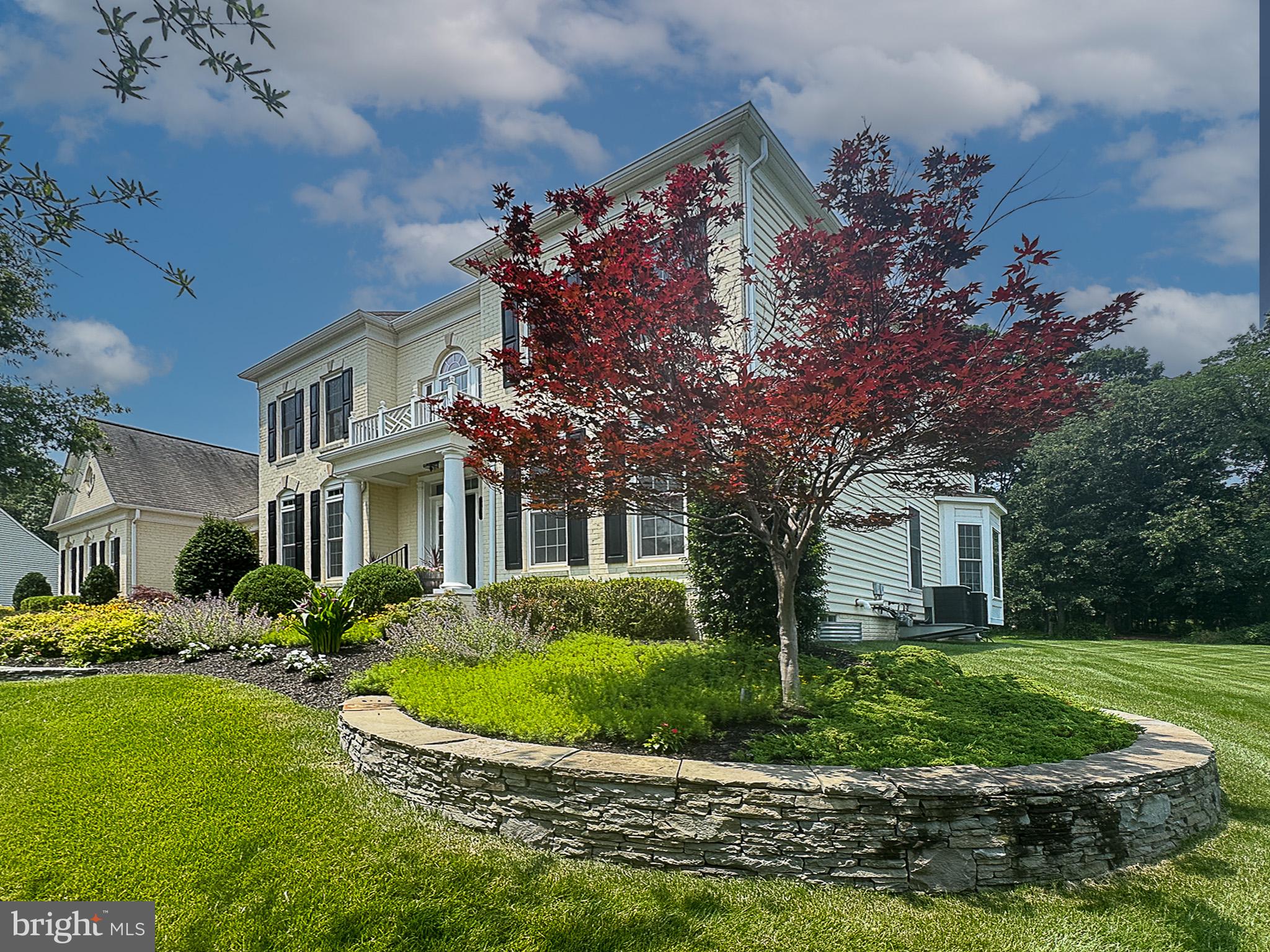20899 McIntosh Place Leesburg, VA 20175 - Photo 49 of 69 a front view of house with yard and green space