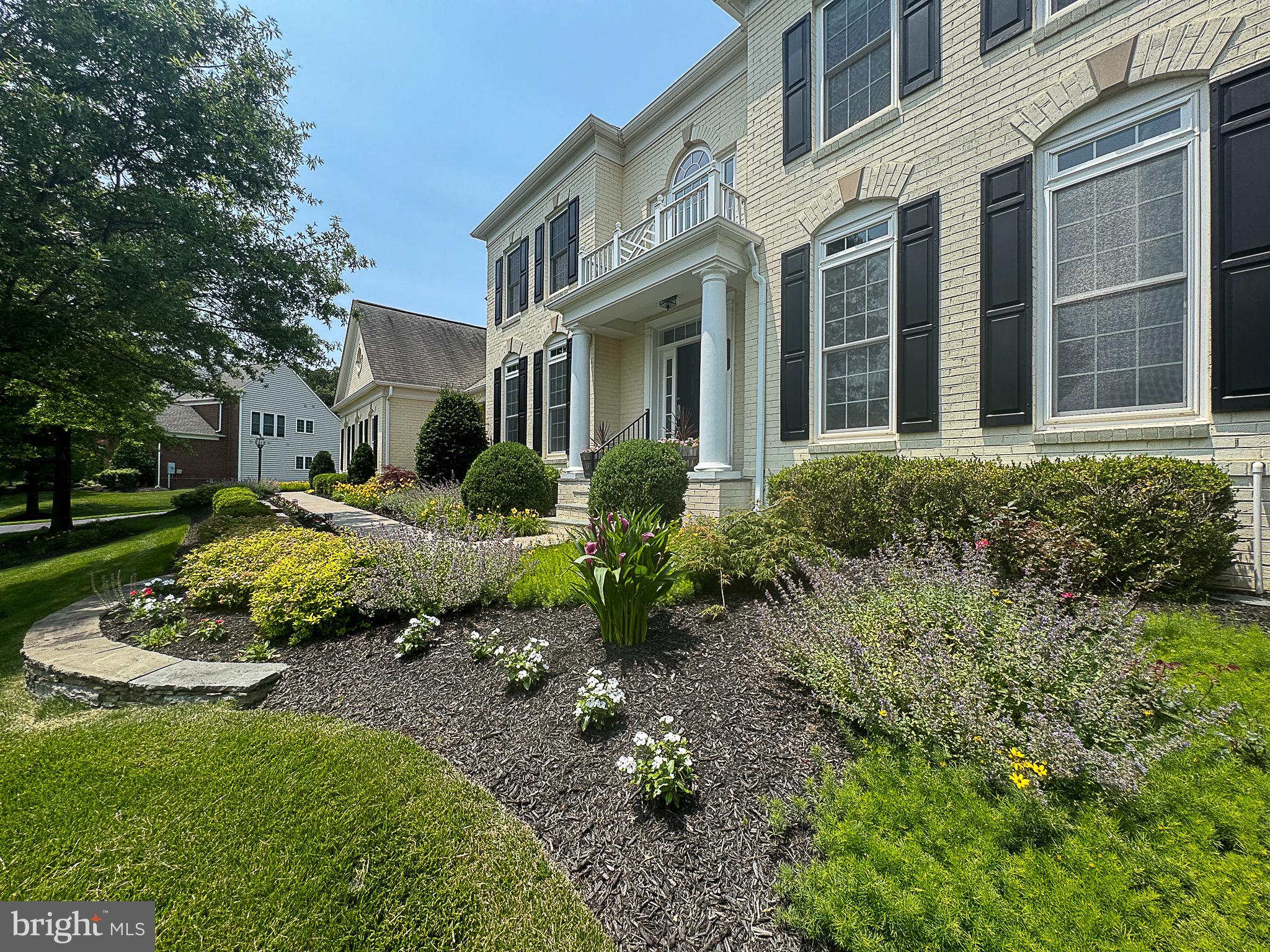 20899 McIntosh Place Leesburg, VA 20175 - Photo 50 of 69 a view of a garden with a fountain