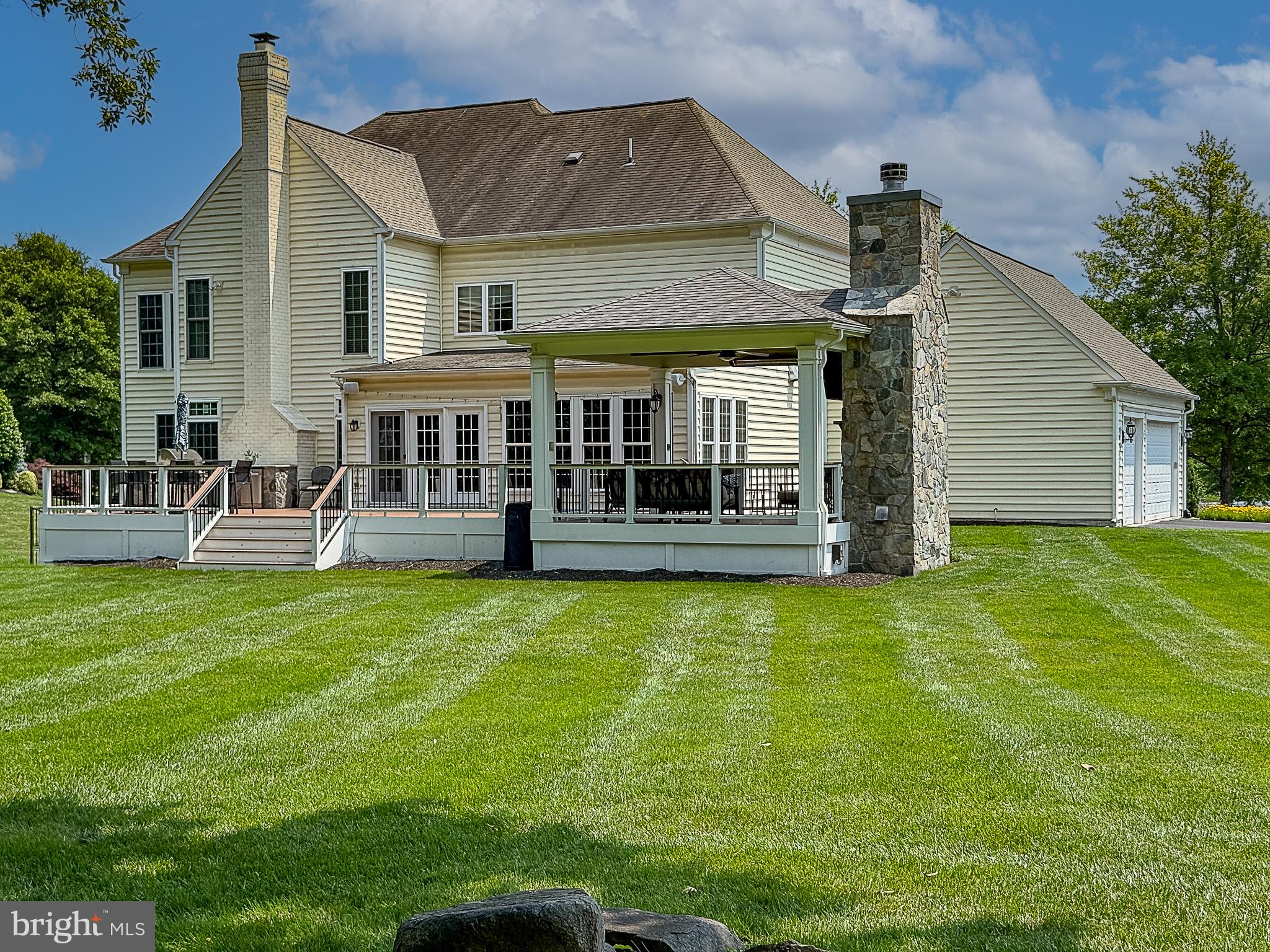20899 McIntosh Place Leesburg, VA 20175 - Photo 53 of 69 a view of a house with pool and a yard