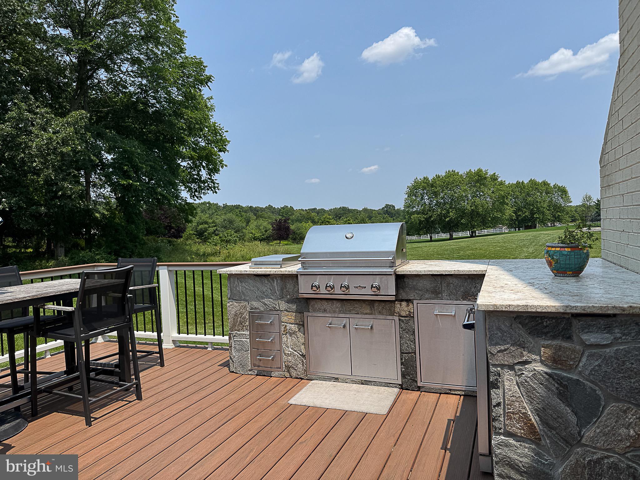 20899 McIntosh Place Leesburg, VA 20175 - Photo 54 of 69 a view of a deck patio and outdoor seating
