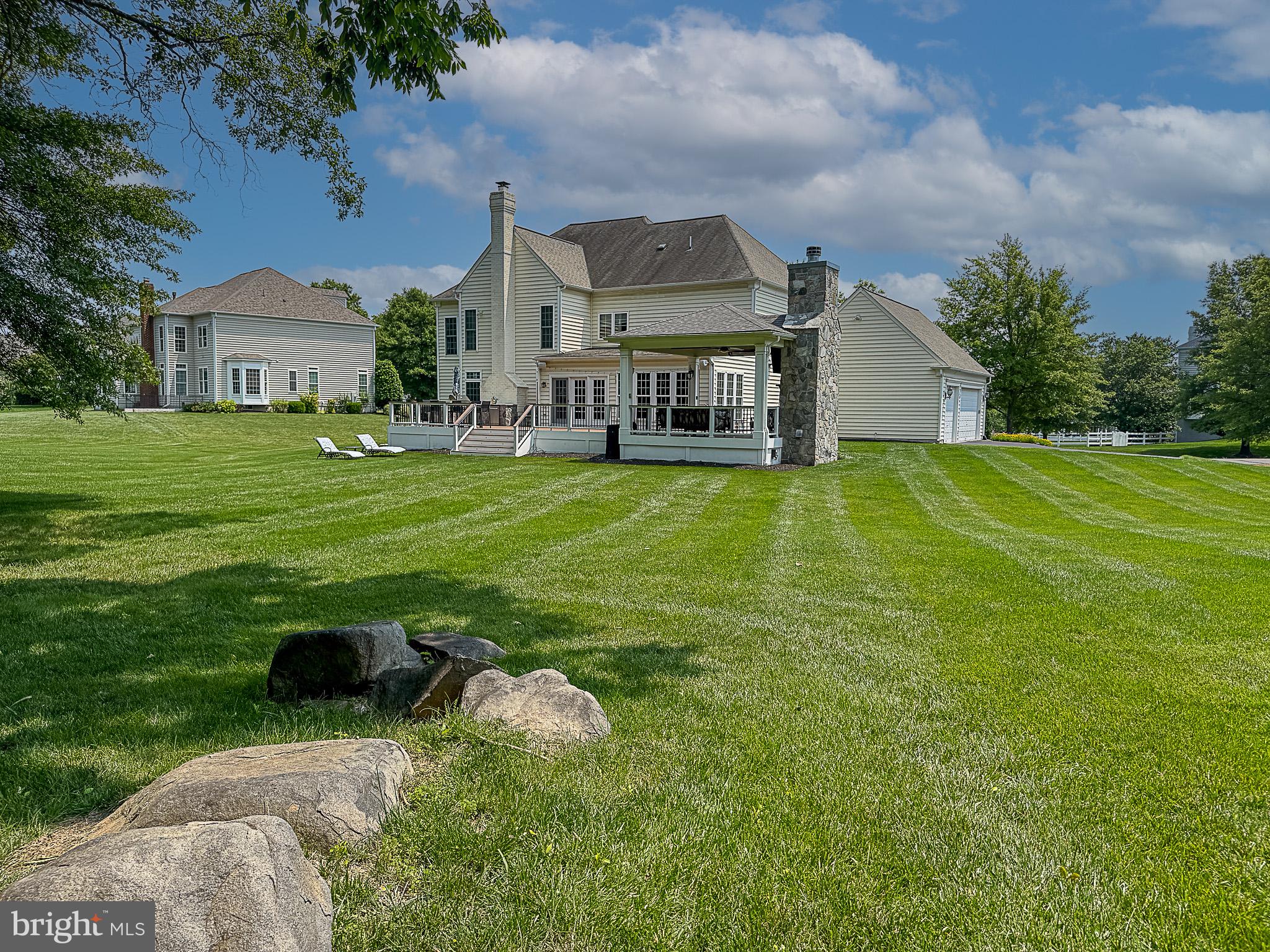 20899 McIntosh Place Leesburg, VA 20175 - Photo 61 of 69 a aerial view of a house with garden and a yard