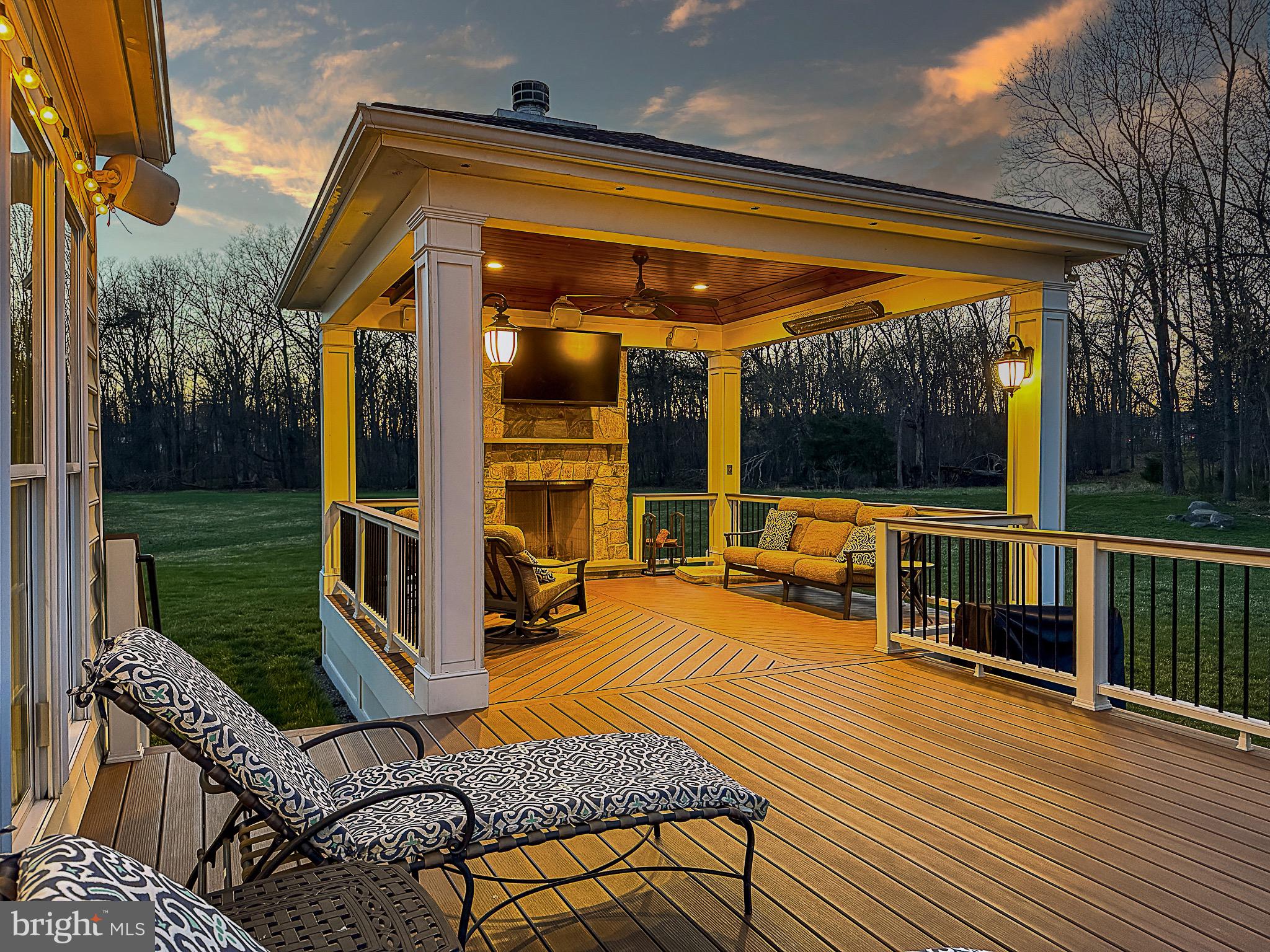 20899 McIntosh Place Leesburg, VA 20175 - Photo 8 of 69 a view of a patio with table and chairs next to a yard