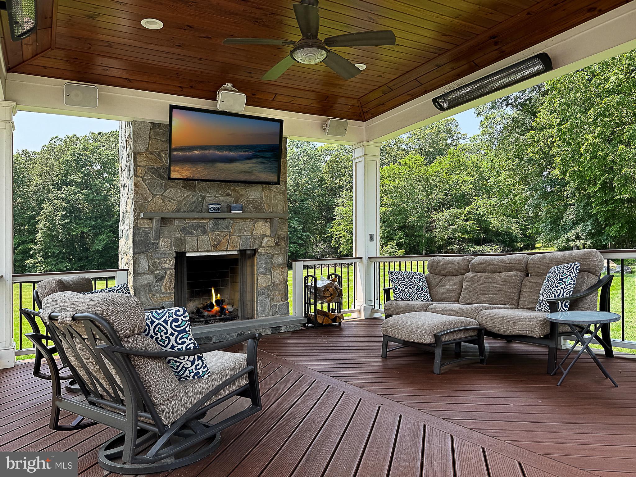 20899 McIntosh Place Leesburg, VA 20175 - Photo 9 of 69 a outdoor living space with furniture and a flat screen tv