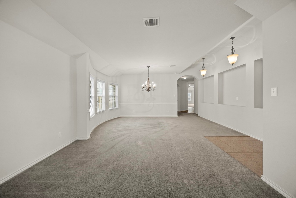2832 Mission Tejas Drive Pflugerville, TX 78660 - Photo 11 of 30 a view of a big room with windows and cabinet