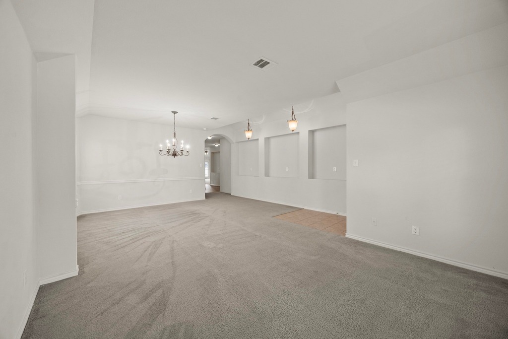 2832 Mission Tejas Drive Pflugerville, TX 78660 - Photo 12 of 30 a view of a big room with white walls and refrigerator