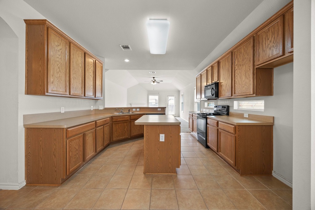 2832 Mission Tejas Drive Pflugerville, TX 78660 - Photo 15 of 30 a large kitchen with stainless steel appliances lots of counter top space