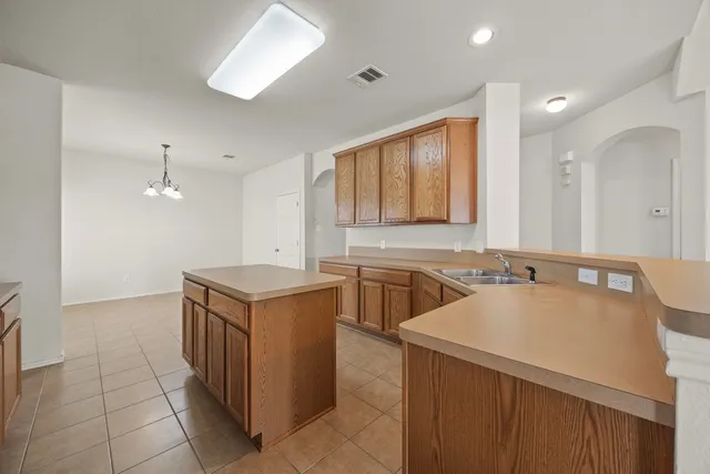 a kitchen with a cabinets and a sink