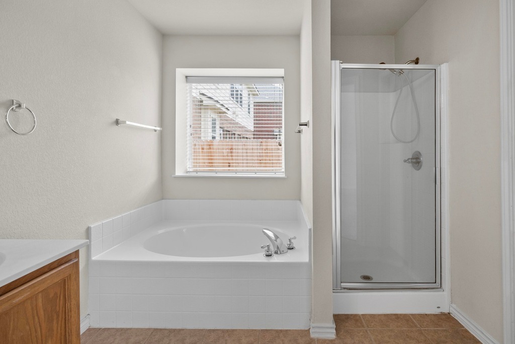 2832 Mission Tejas Drive Pflugerville, TX 78660 - Photo 23 of 30 a white bath tub sitting next to a window