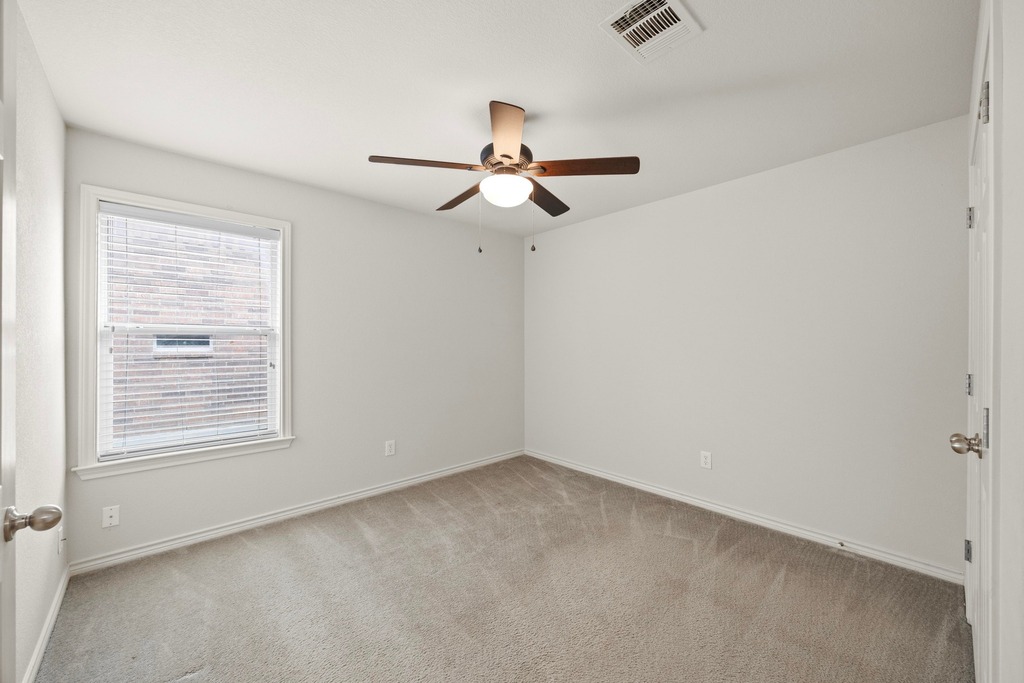 2832 Mission Tejas Drive Pflugerville, TX 78660 - Photo 26 of 30 a view of an empty room with a window