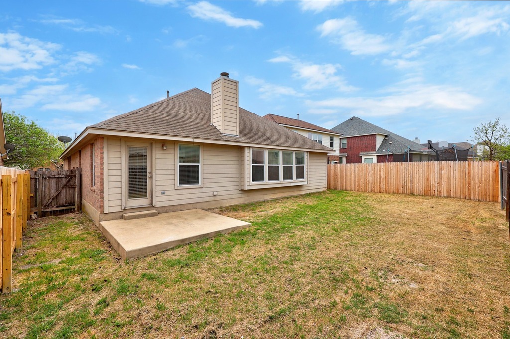 2832 Mission Tejas Drive Pflugerville, TX 78660 - Photo 29 of 30 a view of a house with backyard and wooden fence