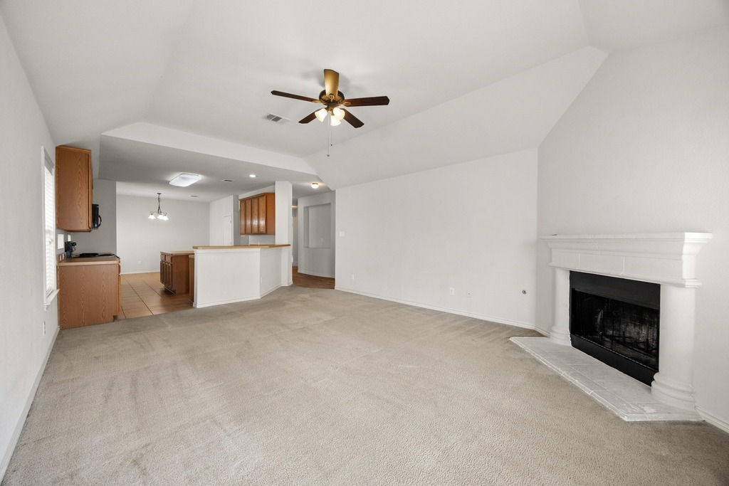 2832 Mission Tejas Drive Pflugerville, TX 78660 - Photo 6 of 30 a living room with furniture and a fireplace