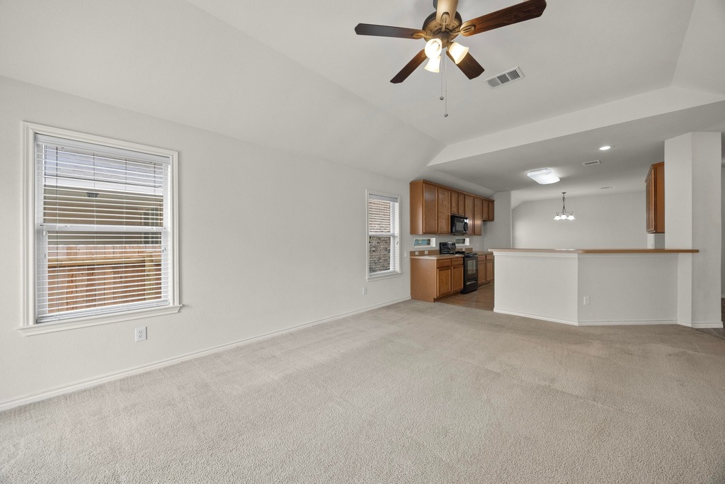 2832 Mission Tejas Drive Pflugerville, TX 78660 - Photo 8 of 30 a view of a kitchen and a windows a ceiling fan