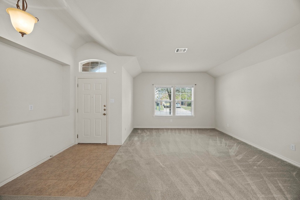 2832 Mission Tejas Drive Pflugerville, TX 78660 - Photo 9 of 30 an empty room with windows