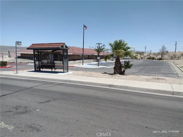 a roof deck view with tall buildings
