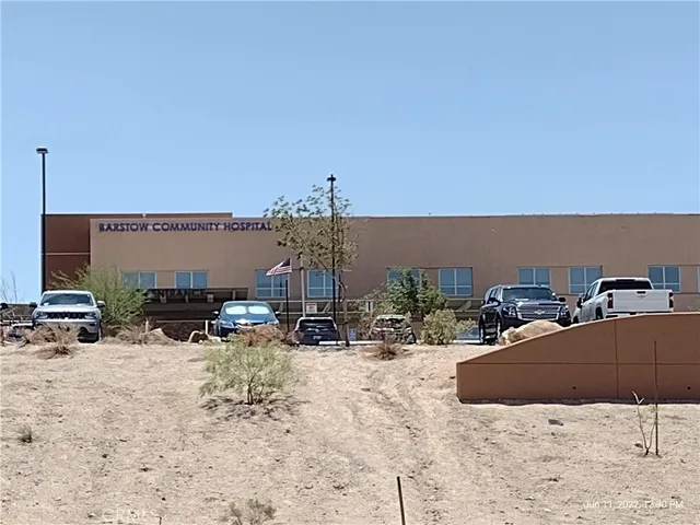 a view of a terrace with chairs and potted plants