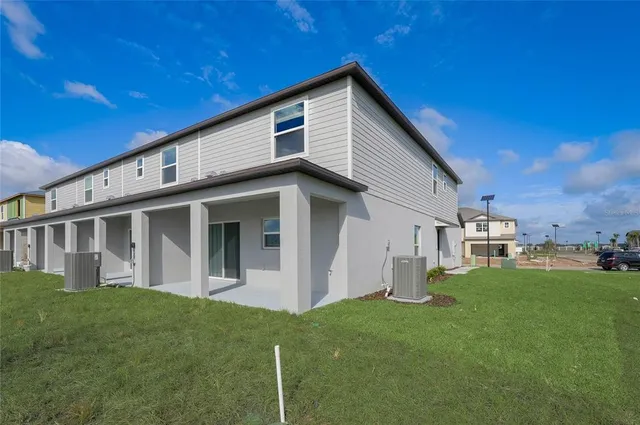 a view of a house with a yard