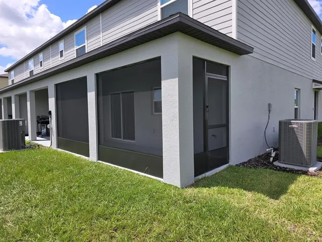 a backyard of a house with lots of green space