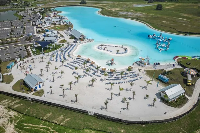 a view of a swimming pool with a yard