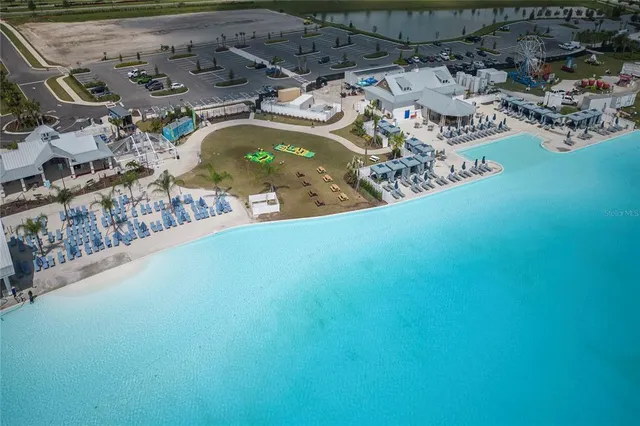 a view of a swimming pool with a yard