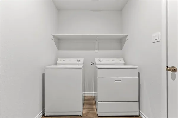 a bathroom with a granite countertop sink a large mirror and a shower