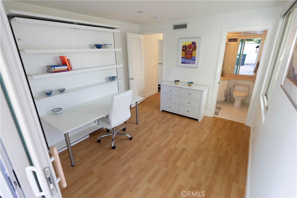 558 Cliff Drive Laguna Beach, CA 92651 - Photo 15 of 25 a workspace with furniture and wooden floor