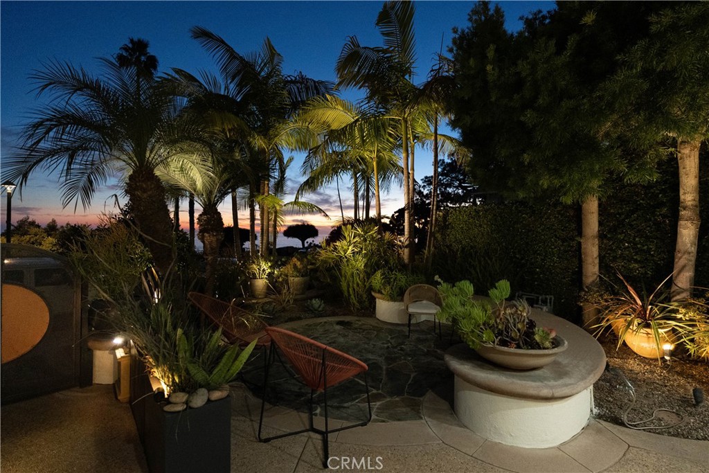 558 Cliff Drive Laguna Beach, CA 92651 - Photo 5 of 25 a view of a backyard with plants and a patio
