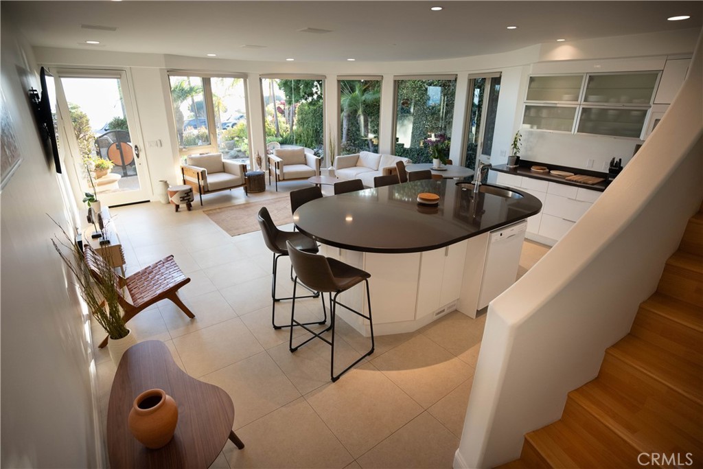 558 Cliff Drive Laguna Beach, CA 92651 - Photo 7 of 25 a dining room with furniture and a large window
