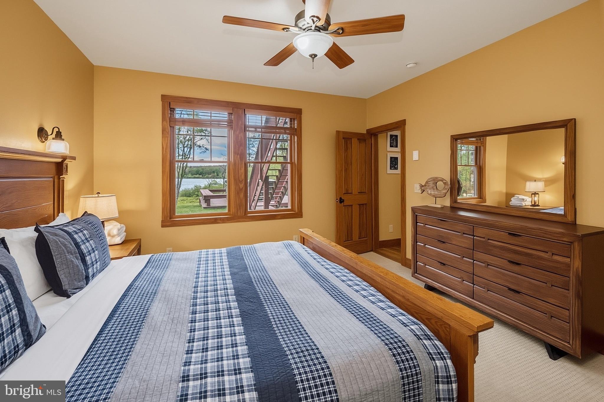 185 Ruta Lane Swanton, MD 21561 - Photo 54 of 81 a bedroom with a bed and wooden floor