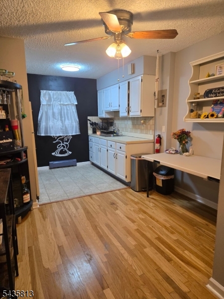 37 Espy Road, Unit 6B Caldwell, NJ 07006 - Photo 4 of 5 a kitchen with stainless steel appliances a stove sink and cabinets