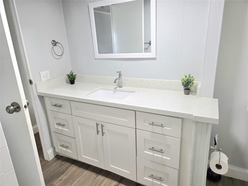 2050 Southwest 83rd Terrace Davie, FL 33324 - Photo 19 of 30 a bathroom with a granite countertop sink and a mirror