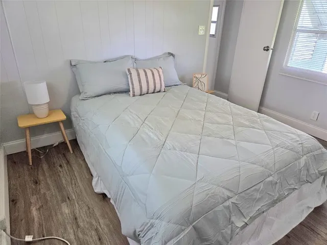 a large white bed in a white room