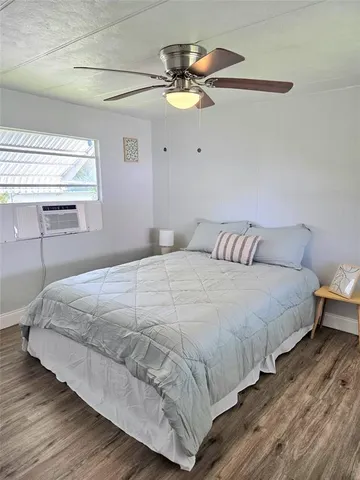 a bedroom with bed and window