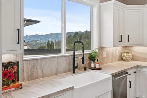 a kitchen with a sink and cabinets