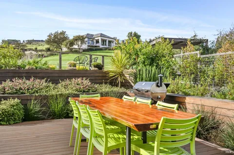 a view of a chairs and table on the terrace