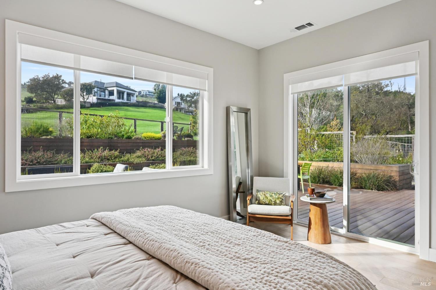 3761 Cross Creek Road Santa Rosa, CA 95403 - Photo 18 of 44 a bedroom with a bed and large windows