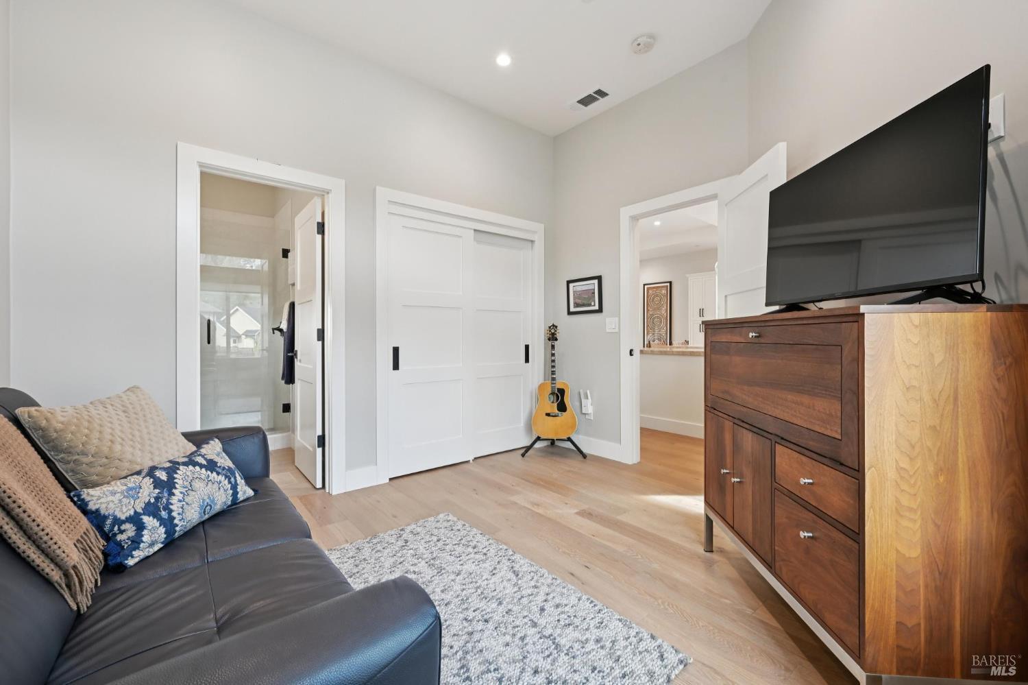 3761 Cross Creek Road Santa Rosa, CA 95403 - Photo 25 of 44 a living room with furniture and a flat screen tv
