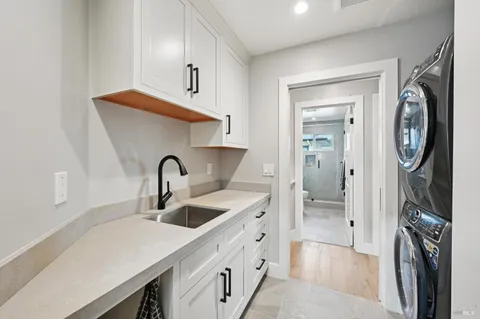 a kitchen with a sink and a refrigerator