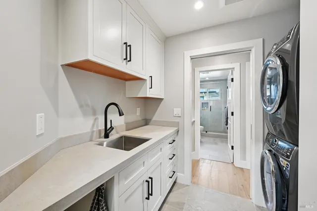 a kitchen with a sink and a refrigerator