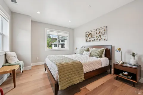 a bedroom with bed and window