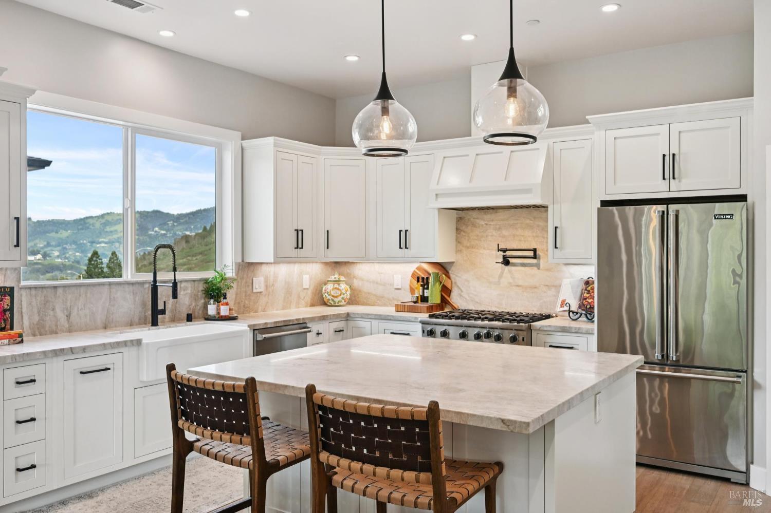 3761 Cross Creek Road Santa Rosa, CA 95403 - Photo 4 of 44 a kitchen with stainless steel appliances granite countertop a sink a stove a refrigerator a center island a stove and a window with wooden floor