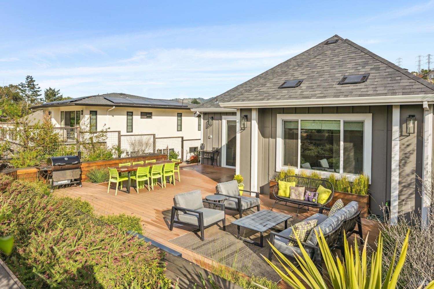 3761 Cross Creek Road Santa Rosa, CA 95403 - Photo 42 of 44 a view of a patio with couches table and chairs with wooden floor and fence