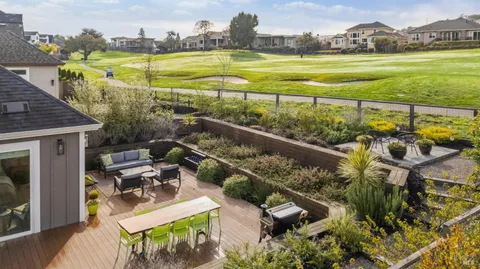 a view of a swimming pool with lounge chairs