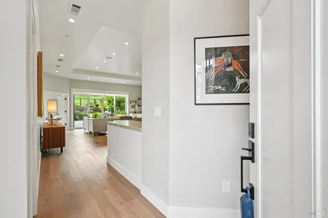 a view of a living room and workspace