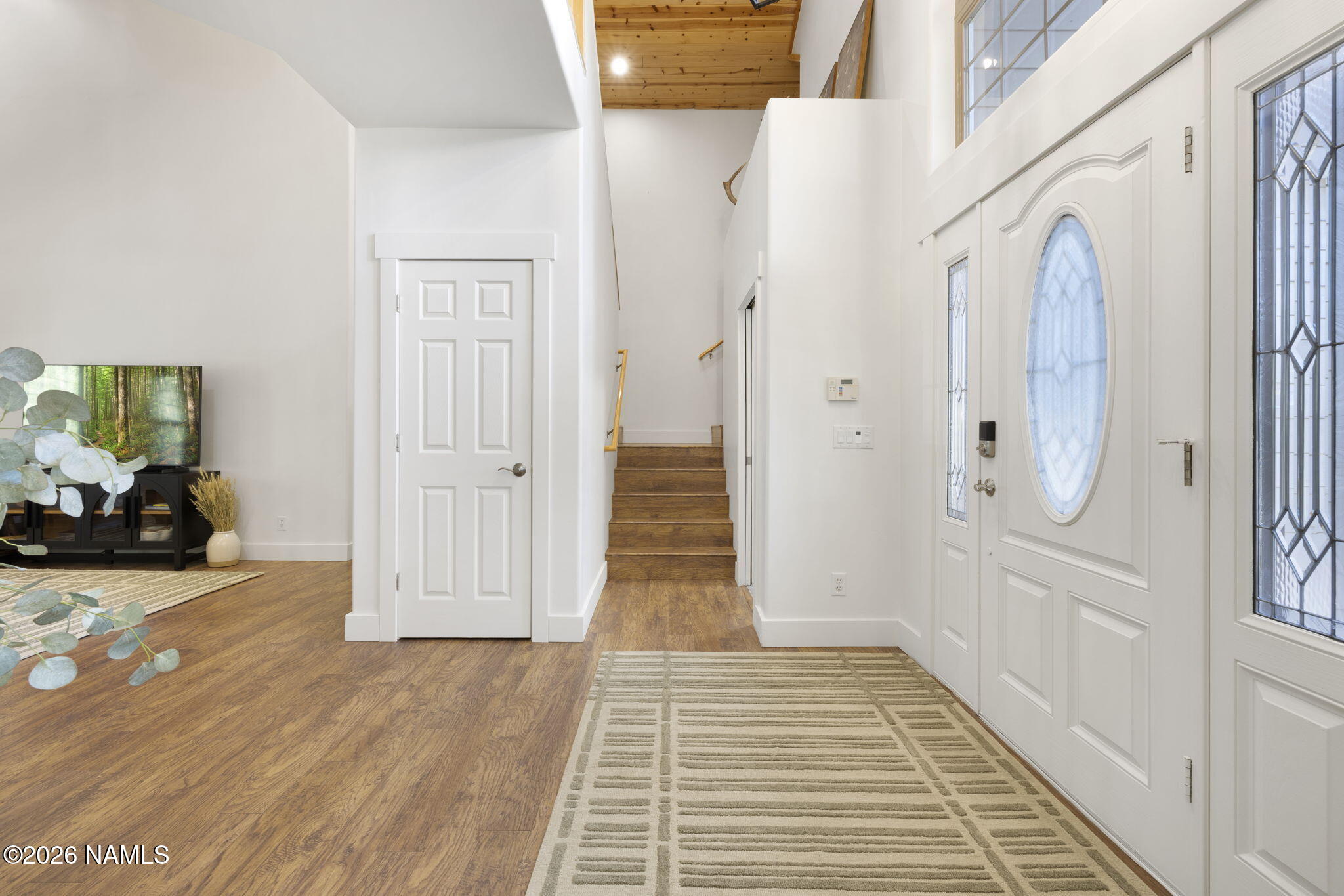 3495 West Lead Rope Flagstaff, AZ 86005 - Photo 9 of 49 a view of a hallway with wooden floor and closet
