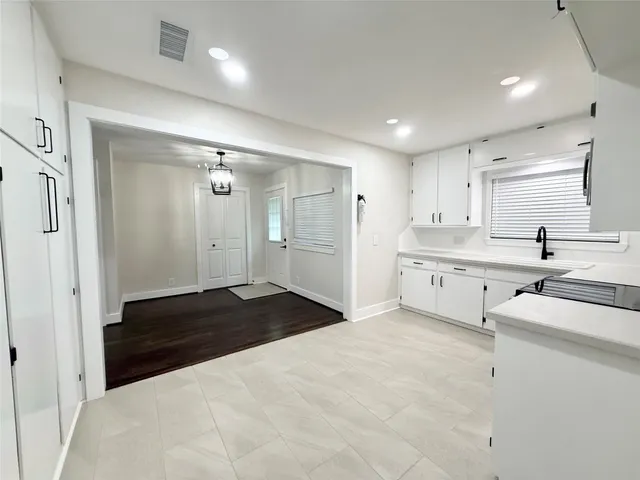 a bathroom with a double vanity sink a mirror and a shower