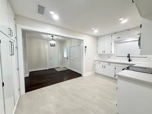 a bathroom with a double vanity sink a mirror and a shower