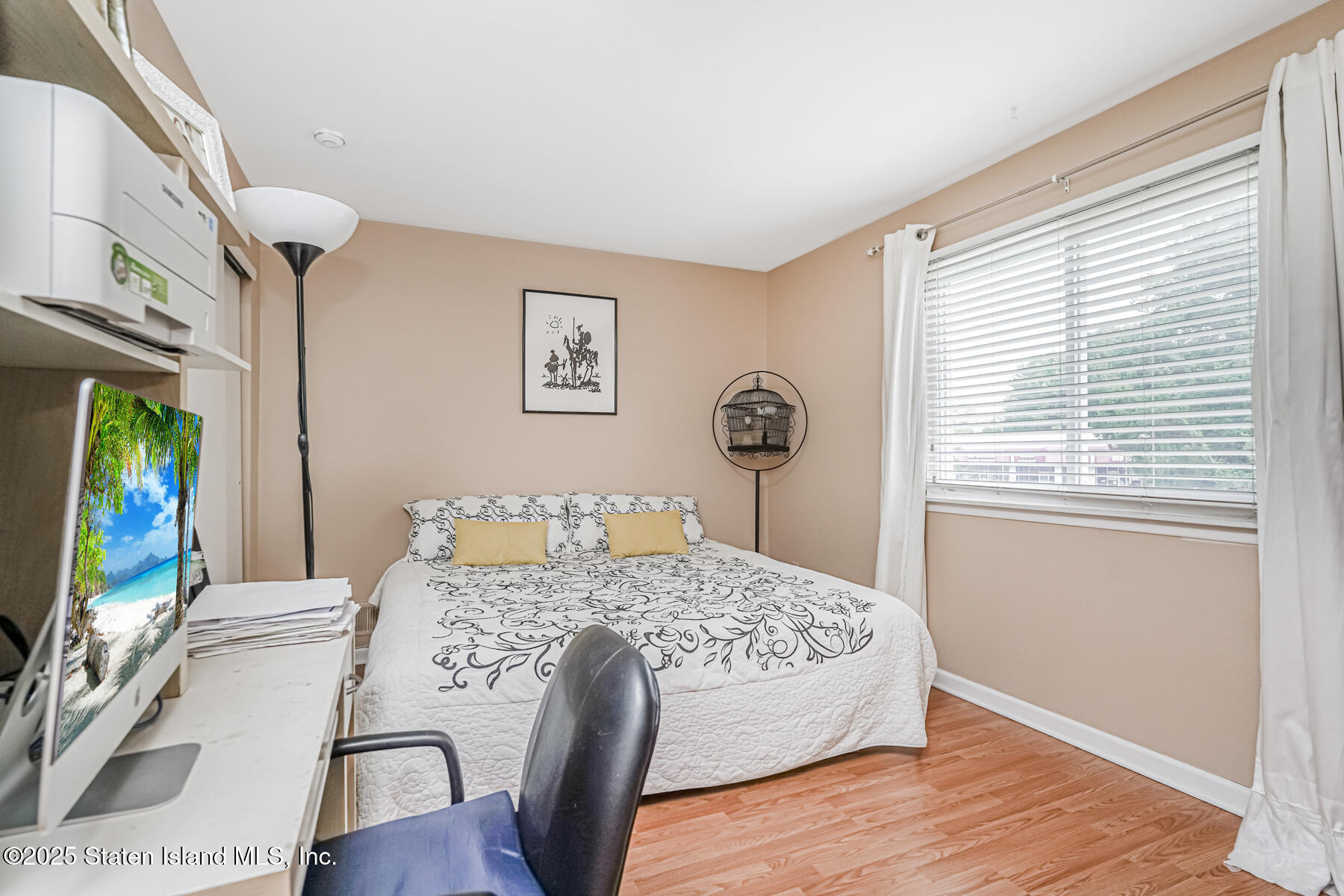 45 Sommer Avenue Staten Island, NY 10314 - Photo 14 of 31 a bedroom with a bed and a flat screen tv