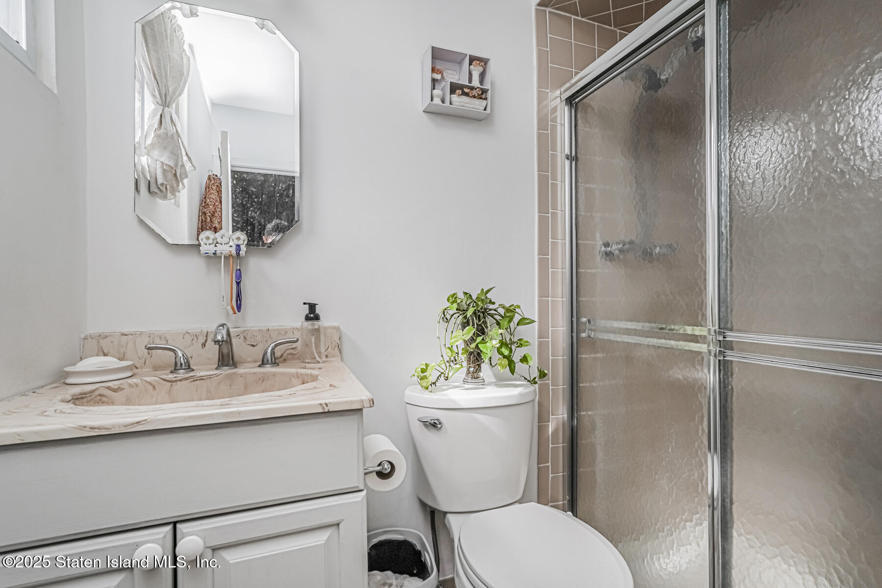45 Sommer Avenue Staten Island, NY 10314 - Photo 18 of 31 a bathroom with a sink toilet and shower