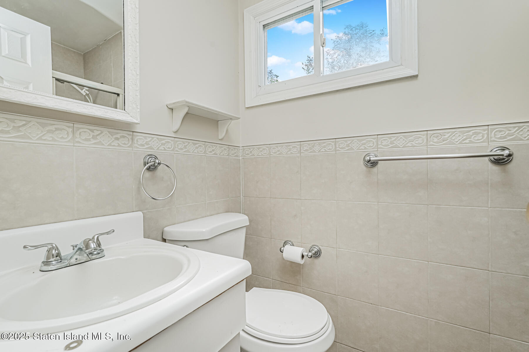 45 Sommer Avenue Staten Island, NY 10314 - Photo 24 of 31 a bathroom with a sink a toilet and shower