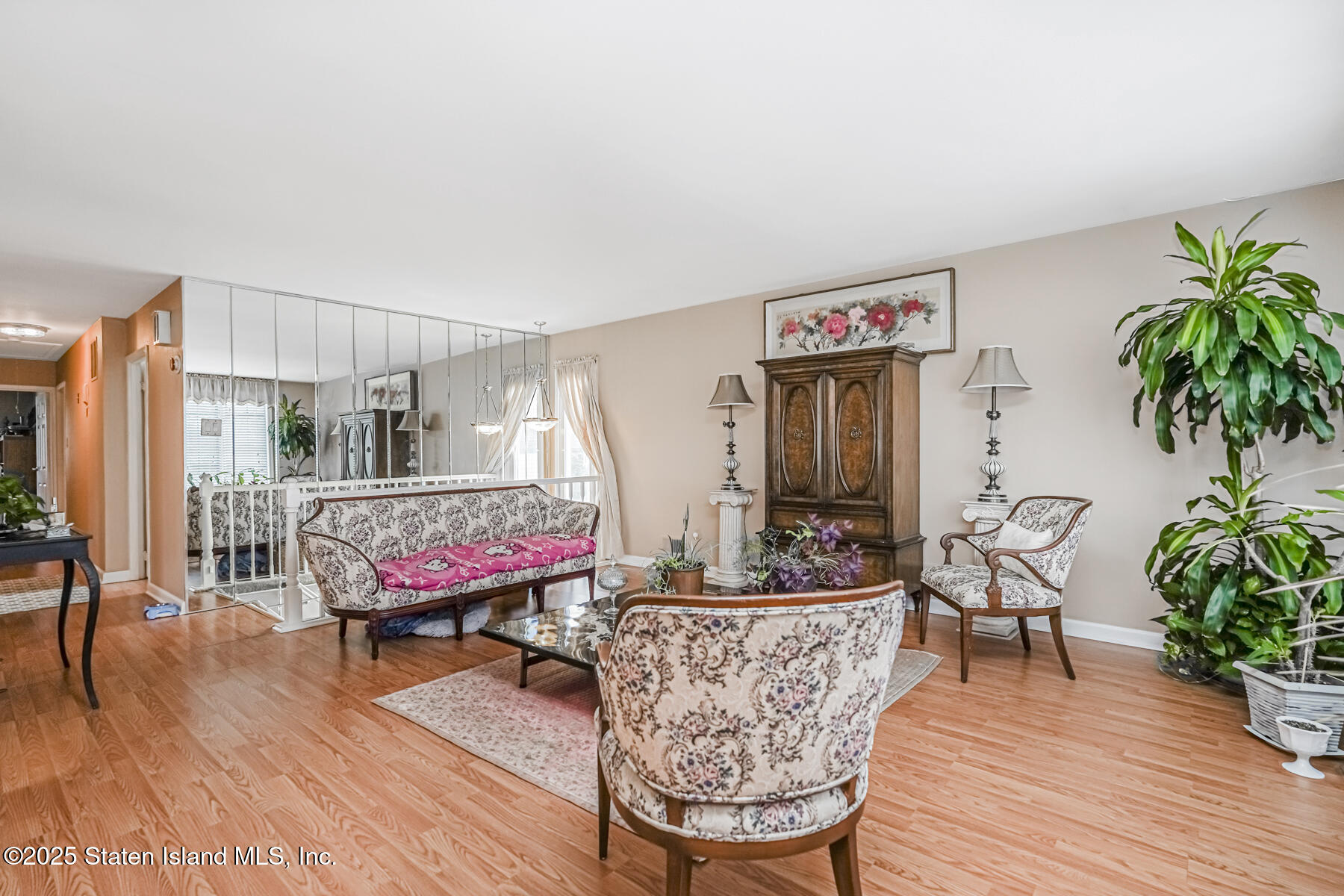45 Sommer Avenue Staten Island, NY 10314 - Photo 3 of 31 a living room with furniture and wooden floor